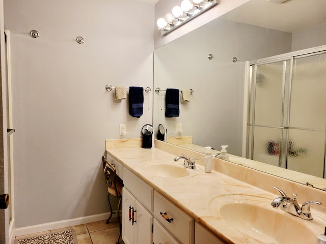 bathroom with vanity, tile patterned floors, and walk in shower