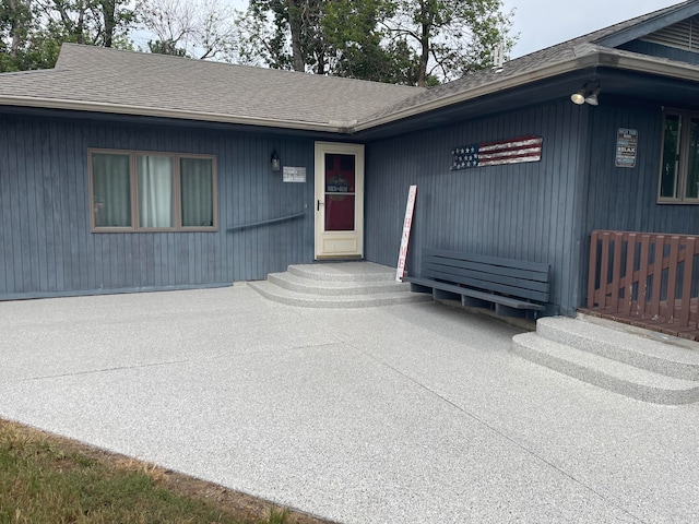 property entrance featuring a patio