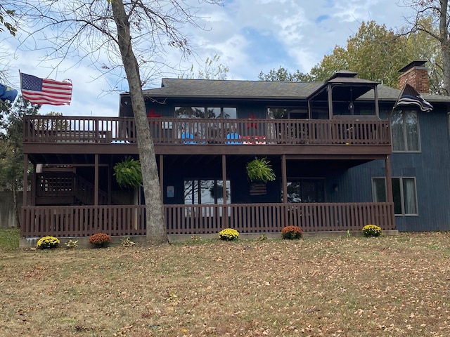 rear view of house with a wooden deck