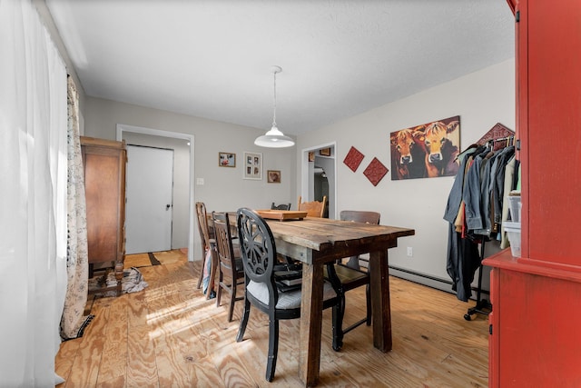 dining room with light wood-style floors