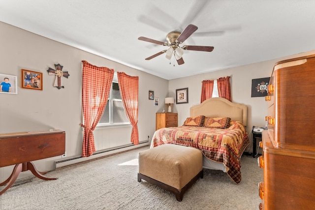 bedroom featuring a baseboard radiator, carpet, and a ceiling fan