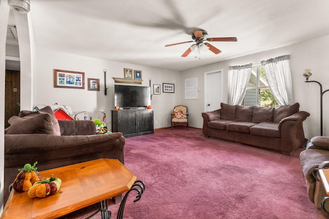 living room featuring carpet floors and ceiling fan