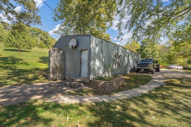 view of outdoor structure with a lawn