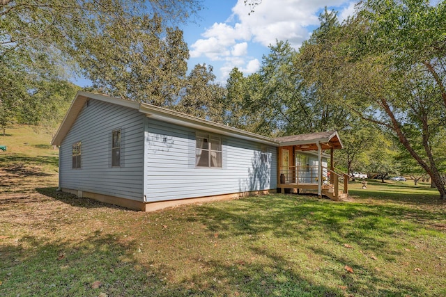 exterior space featuring covered porch and a yard