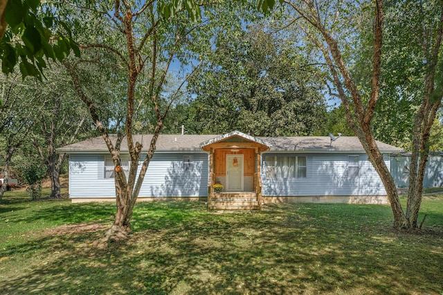 ranch-style home featuring a front yard