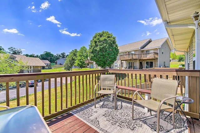 wooden deck with a yard