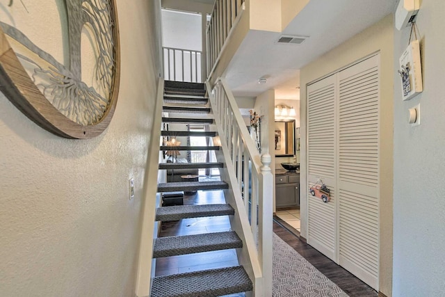 staircase featuring hardwood / wood-style floors