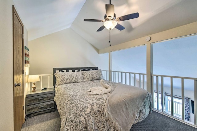 bedroom with multiple windows, ceiling fan, vaulted ceiling, and carpet flooring