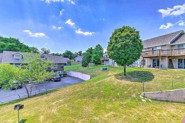 view of yard featuring a patio and a deck