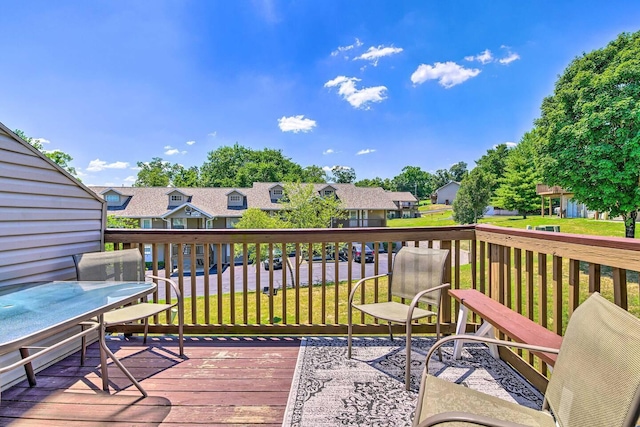 wooden deck with a yard