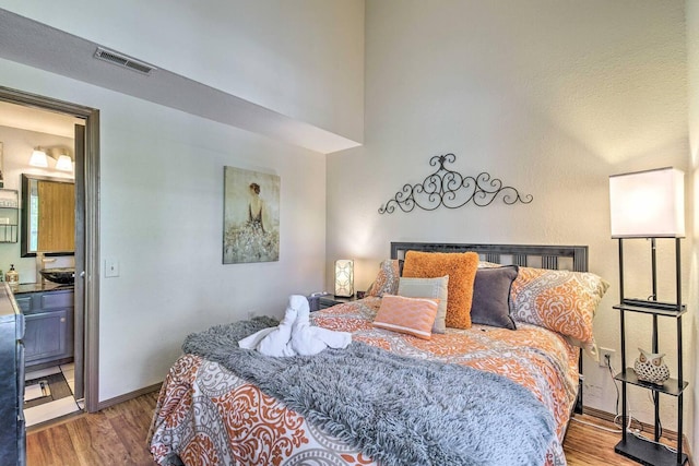 bedroom with wood-type flooring