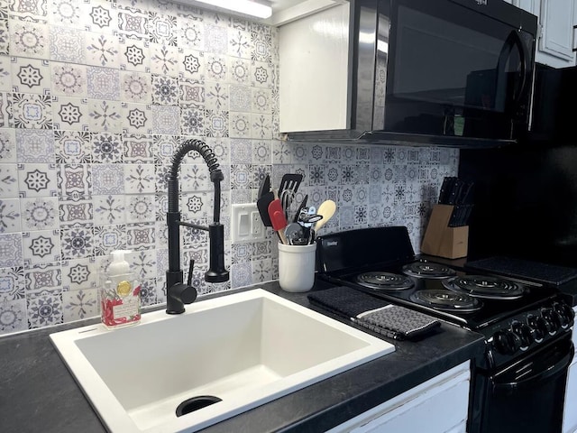 29 Fall Creek Dr Unit 4, Branson, MO 65616 - kitchen with electric range, decorative backsplash, and dark countertops