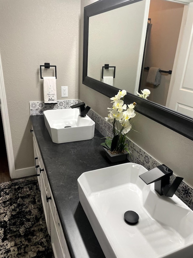 29 Fall Creek Dr Unit 4, Branson, MO 65616 - full bath featuring double vanity and baseboards