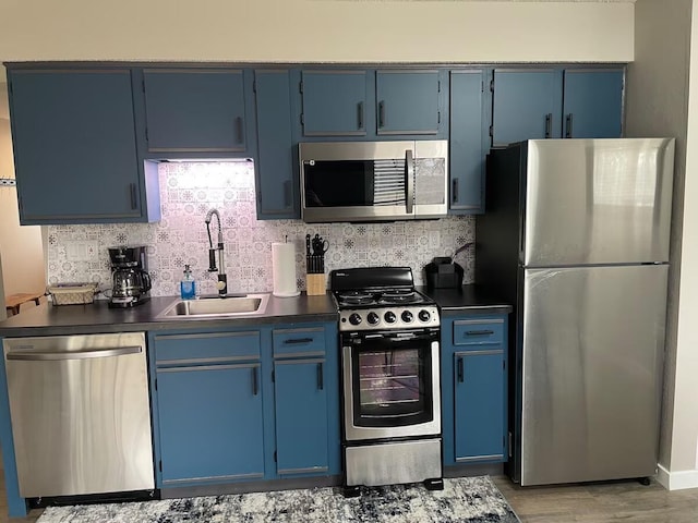 16 Fall Creek Trl Unit 2, Branson, MO 65616 - kitchen featuring stainless steel appliances, dark countertops, and blue cabinets