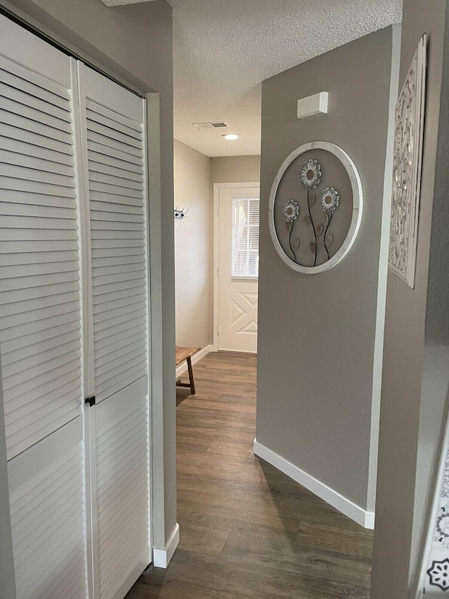 16 Fall Creek Trl Unit 2, Branson, MO 65616 - hall with a textured ceiling and dark wood finished floors