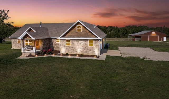 view of front of property featuring a yard and a patio