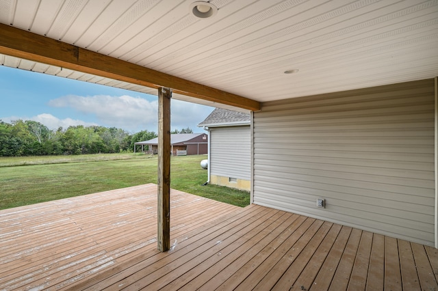 wooden terrace with a yard