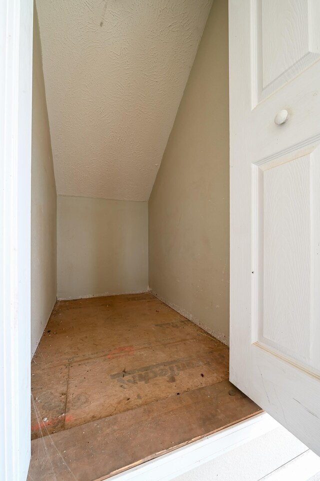 additional living space with vaulted ceiling