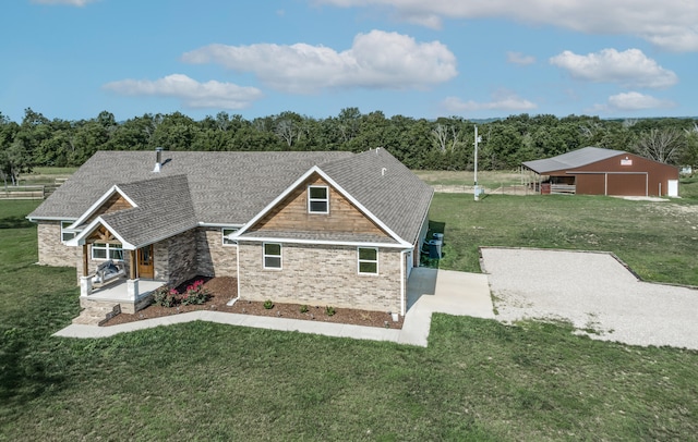 view of front facade with a patio and a front yard