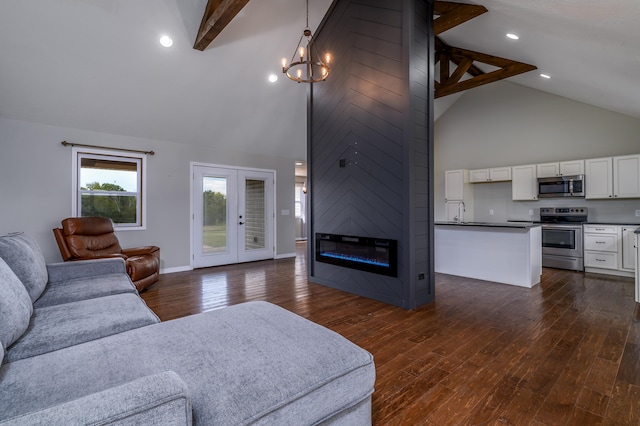 living room featuring beamed ceiling, high vaulted ceiling, and dark hardwood / wood-style floors