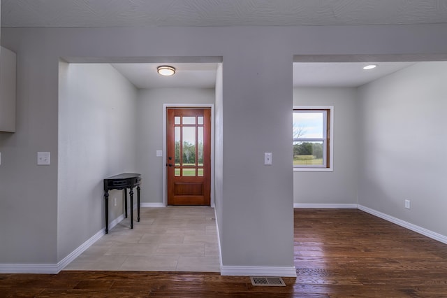 foyer entrance with hardwood / wood-style flooring