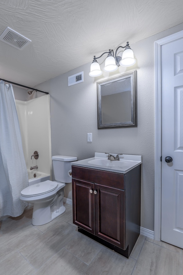 full bathroom with shower / bath combination with curtain, vanity, and toilet