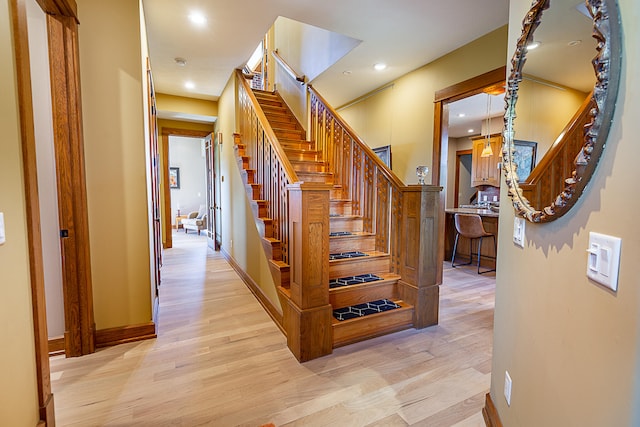 stairway featuring wood-type flooring