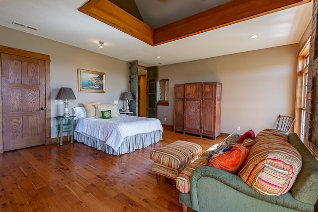 bedroom with hardwood / wood-style flooring