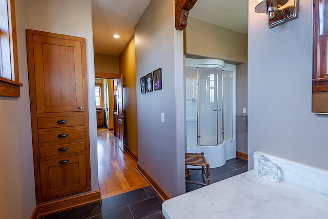 corridor featuring dark hardwood / wood-style flooring