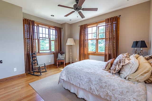 bedroom featuring ceiling fan and light hardwood / wood-style floors