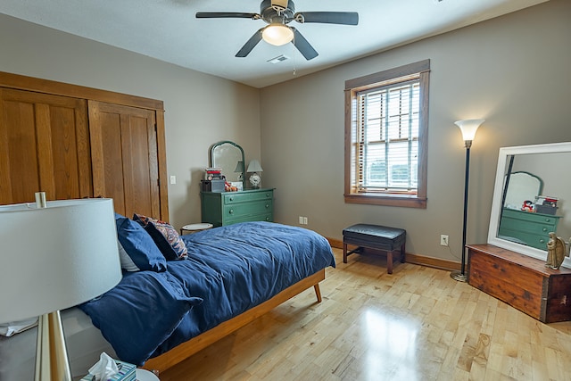 bedroom with ceiling fan and light hardwood / wood-style flooring