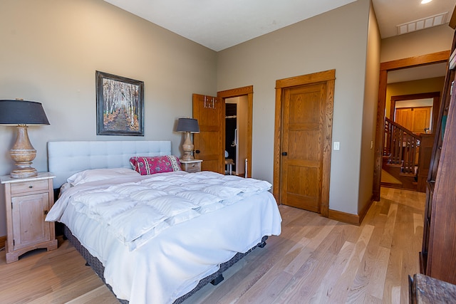 bedroom with light wood-type flooring