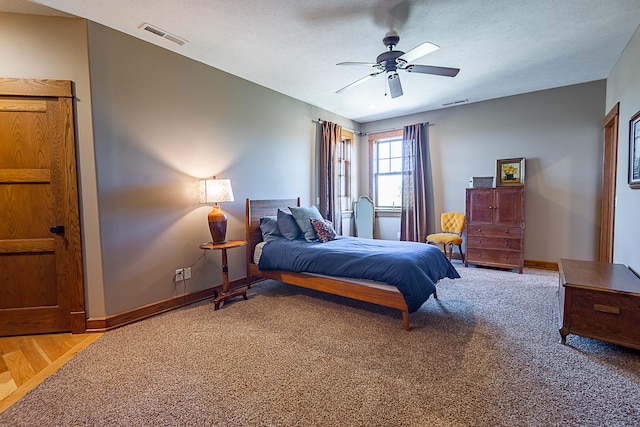 bedroom featuring ceiling fan and light hardwood / wood-style flooring