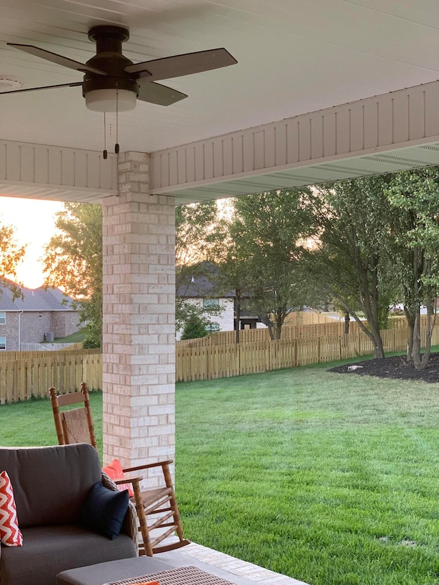 yard at dusk with ceiling fan