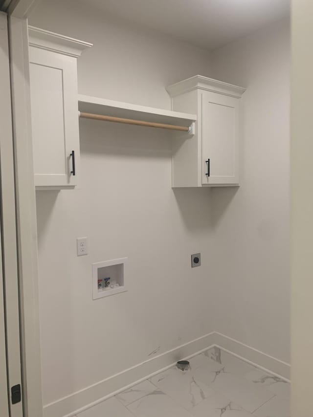 washroom featuring washer hookup, electric dryer hookup, and cabinets