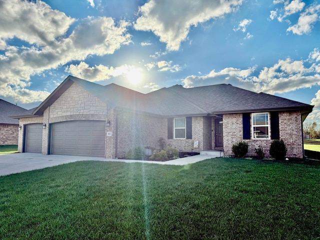 view of front of house with a garage and a front yard