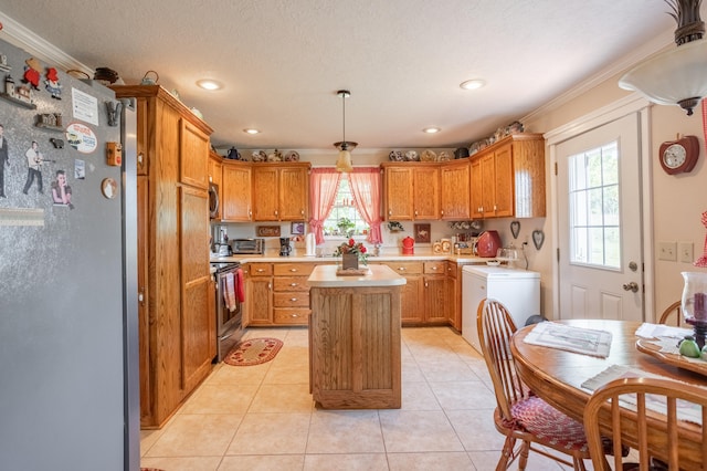 kitchen featuring ornamental molding, a kitchen island, plenty of natural light, and stainless steel appliances