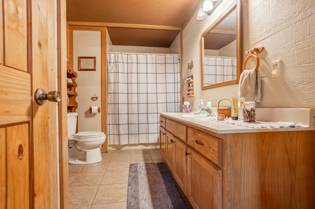 bathroom with vanity, tile walls, toilet, and tile patterned floors