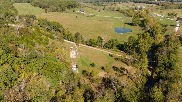 birds eye view of property featuring a rural view