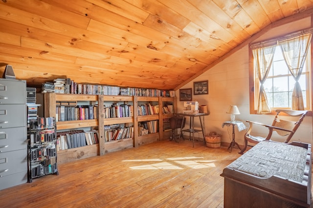 sitting room featuring lofted ceiling, wood-type flooring, and wood ceiling