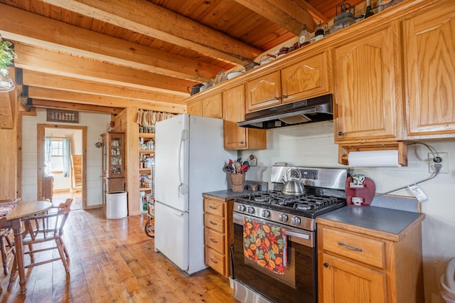 kitchen with wood ceiling, stainless steel gas stove, white refrigerator, light hardwood / wood-style flooring, and beam ceiling