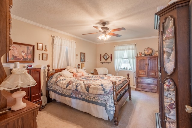 bedroom with ornamental molding, ceiling fan, and light colored carpet