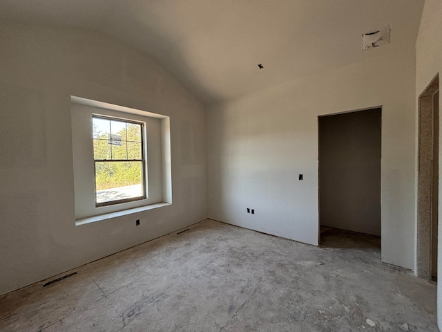 unfurnished bedroom with vaulted ceiling