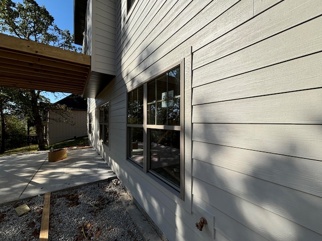 view of property exterior featuring a patio