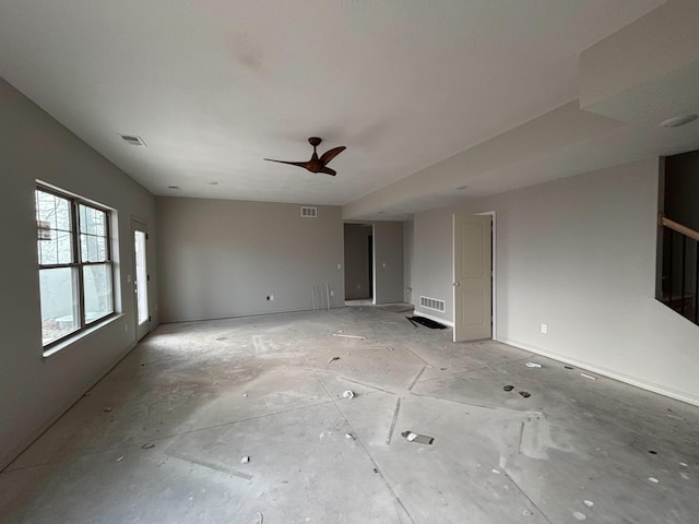 unfurnished living room with ceiling fan