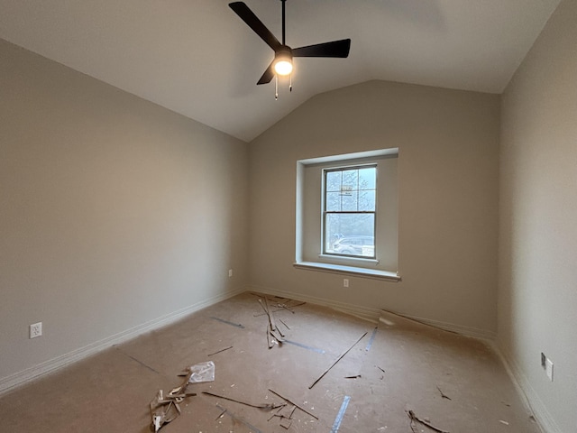 spare room featuring vaulted ceiling and ceiling fan