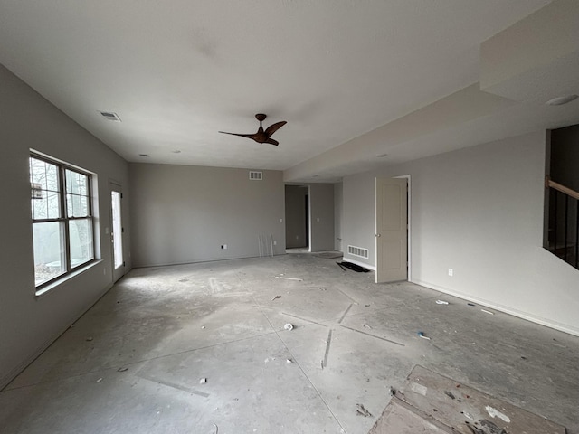 unfurnished living room featuring ceiling fan