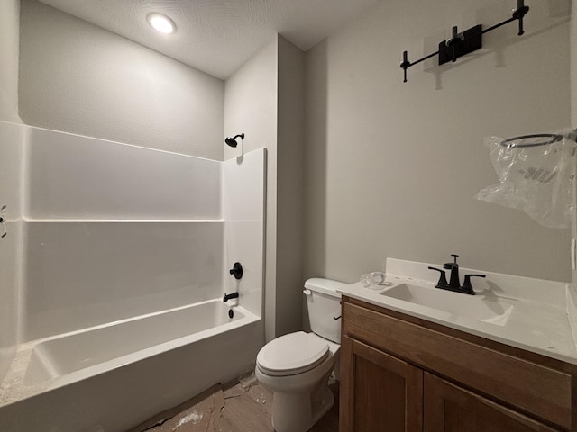 full bathroom with vanity, a textured ceiling, toilet, and shower / bathing tub combination