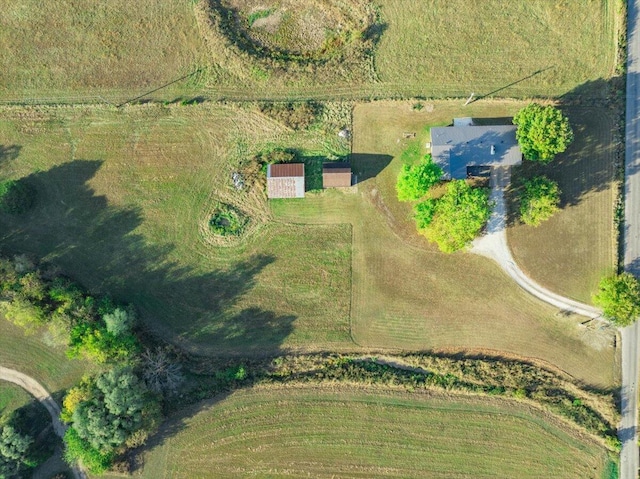 birds eye view of property with a rural view