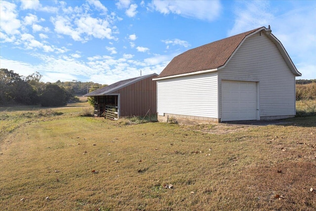 garage featuring a yard